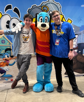 Zach standing next to Toon Dog Flippy and lead producer for Toontown Rewritten